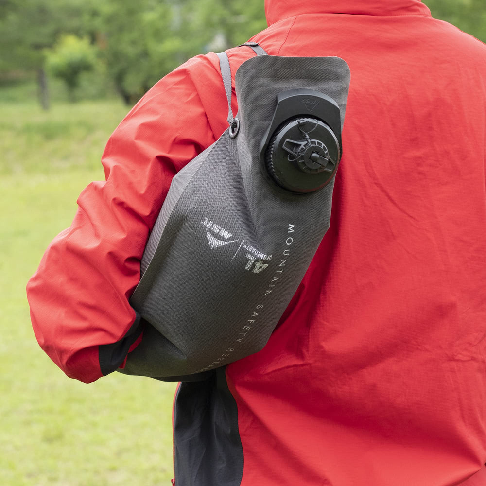 MSR Dromedary Bag in use, delivering water on a long trek with ease.