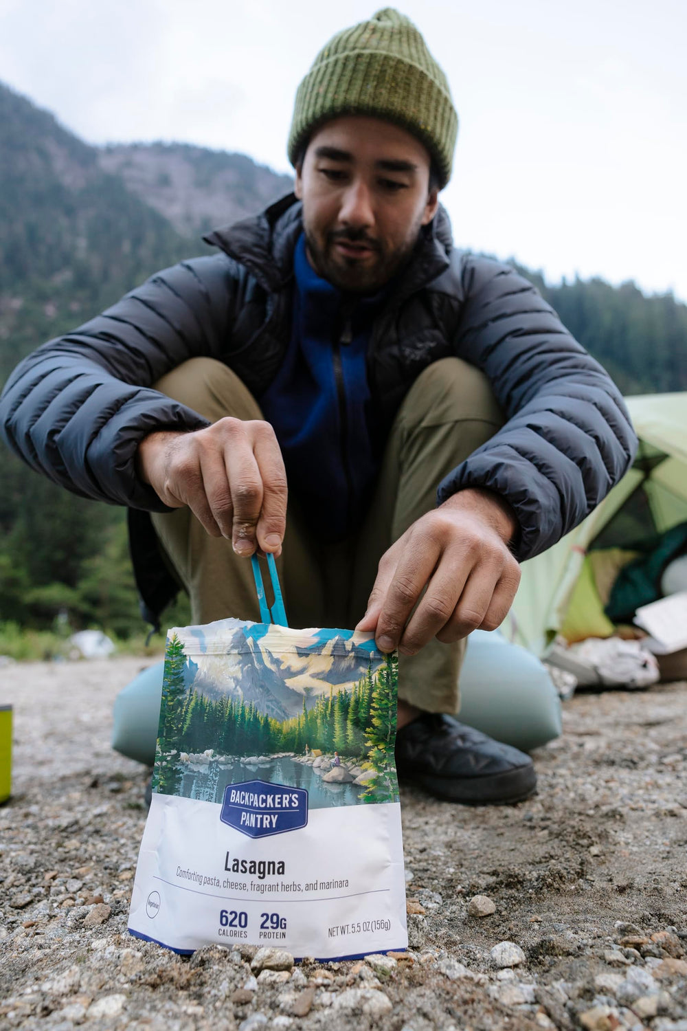 MSR folding camping spork closed inside mug for compact packing.