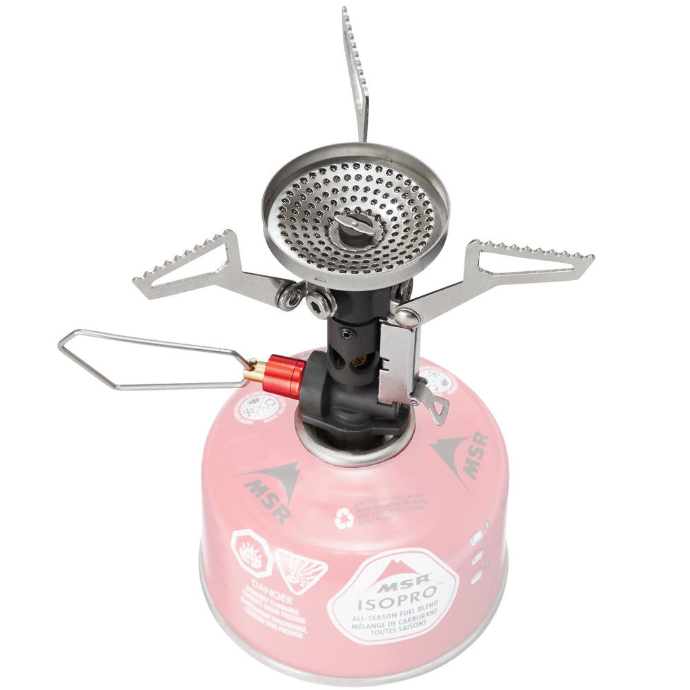 MSR PocketRocket Deluxe stove in use showing precise flame for outdoor meals.