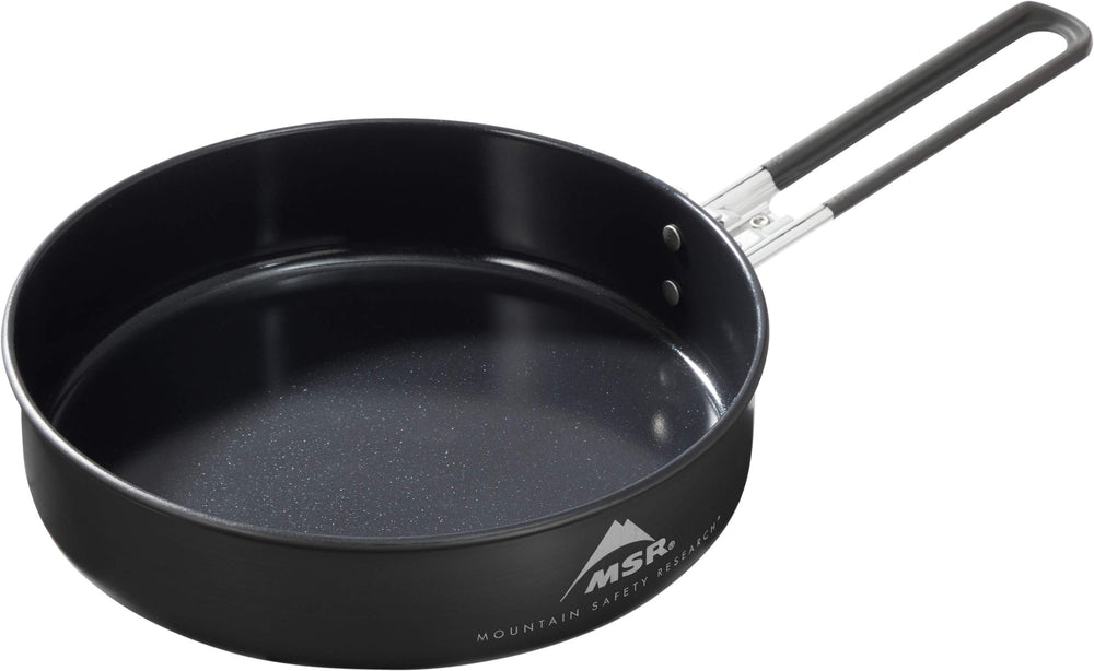 MSR ceramic skillet with fusion coating sizzling vegetables for quick camp meals