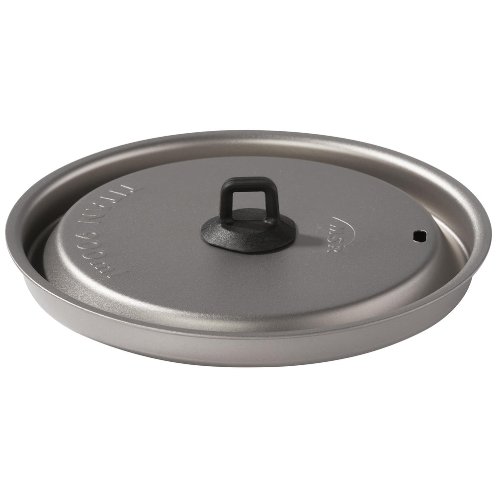 MSR Titan kettle pour-spout design enables controlled pouring into meals.