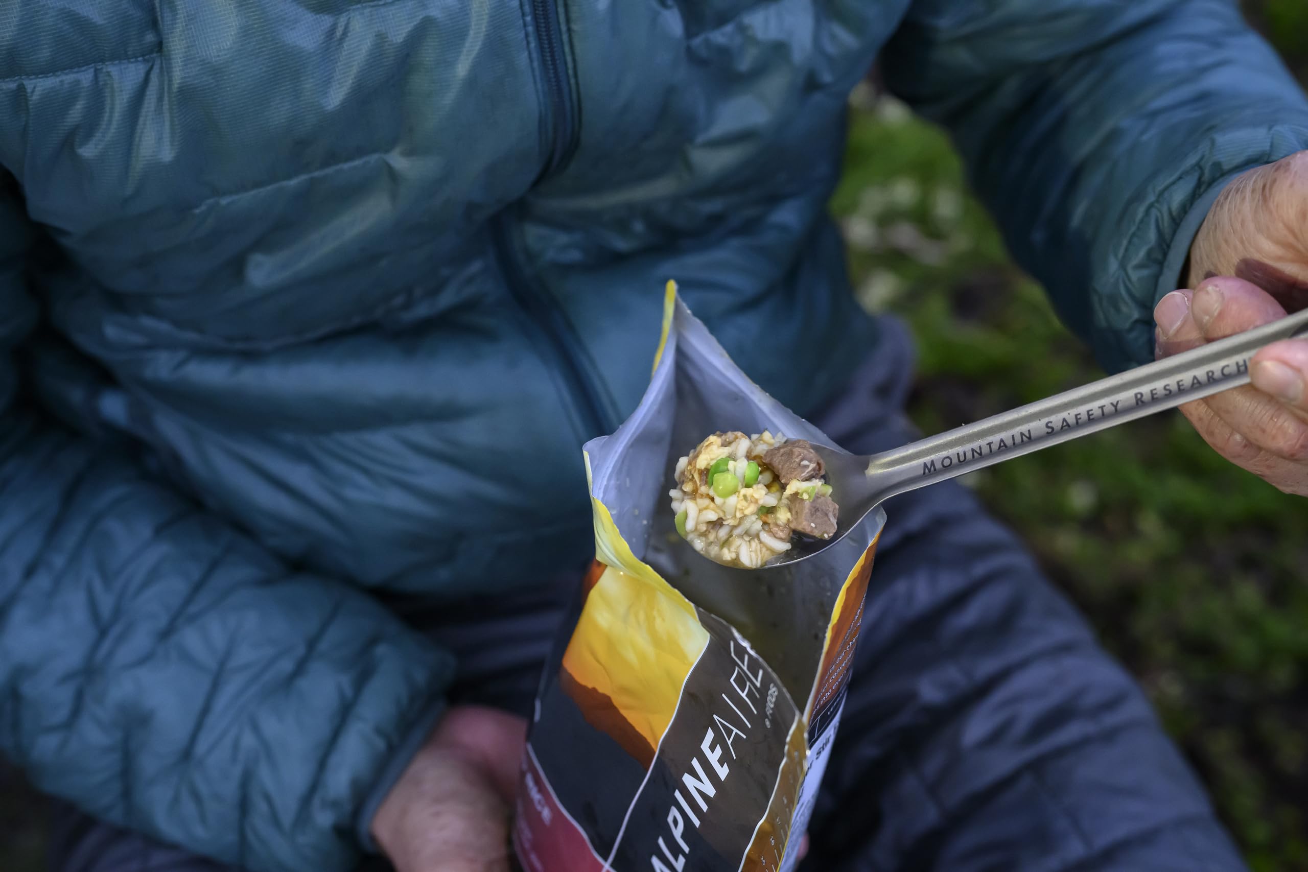 MSR Titan spoon in use with a camping meal for a smooth scoop