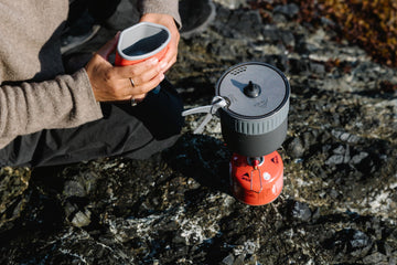 MSR Trail Mini Duo insulated grip highlights safe handling of hot pots outdoors.