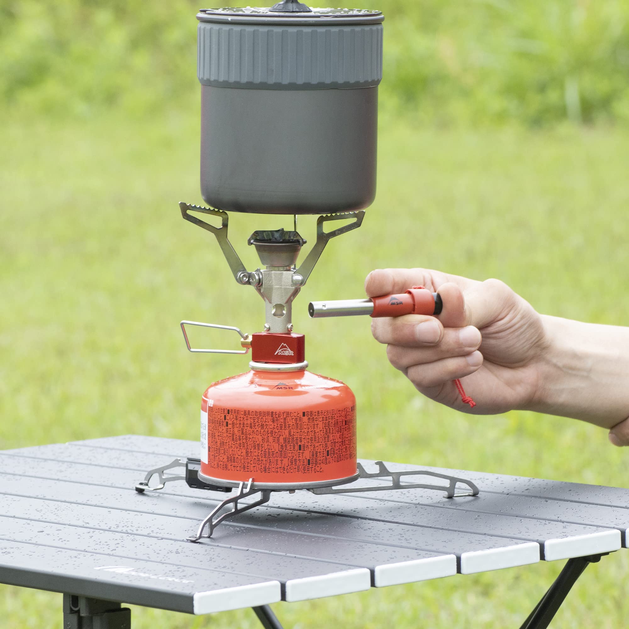 MSR Universal Canister Stand adjustment system fits most canisters quickly for flexible outdoor setups.