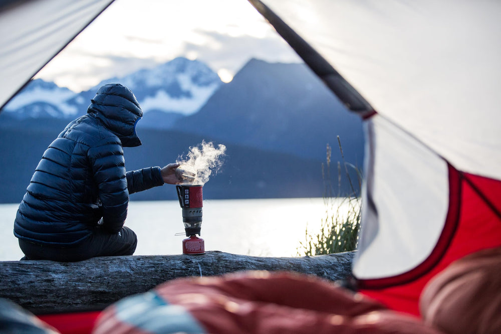 MSR WindBurner in use outdoors after a hike, cooking a hot meal