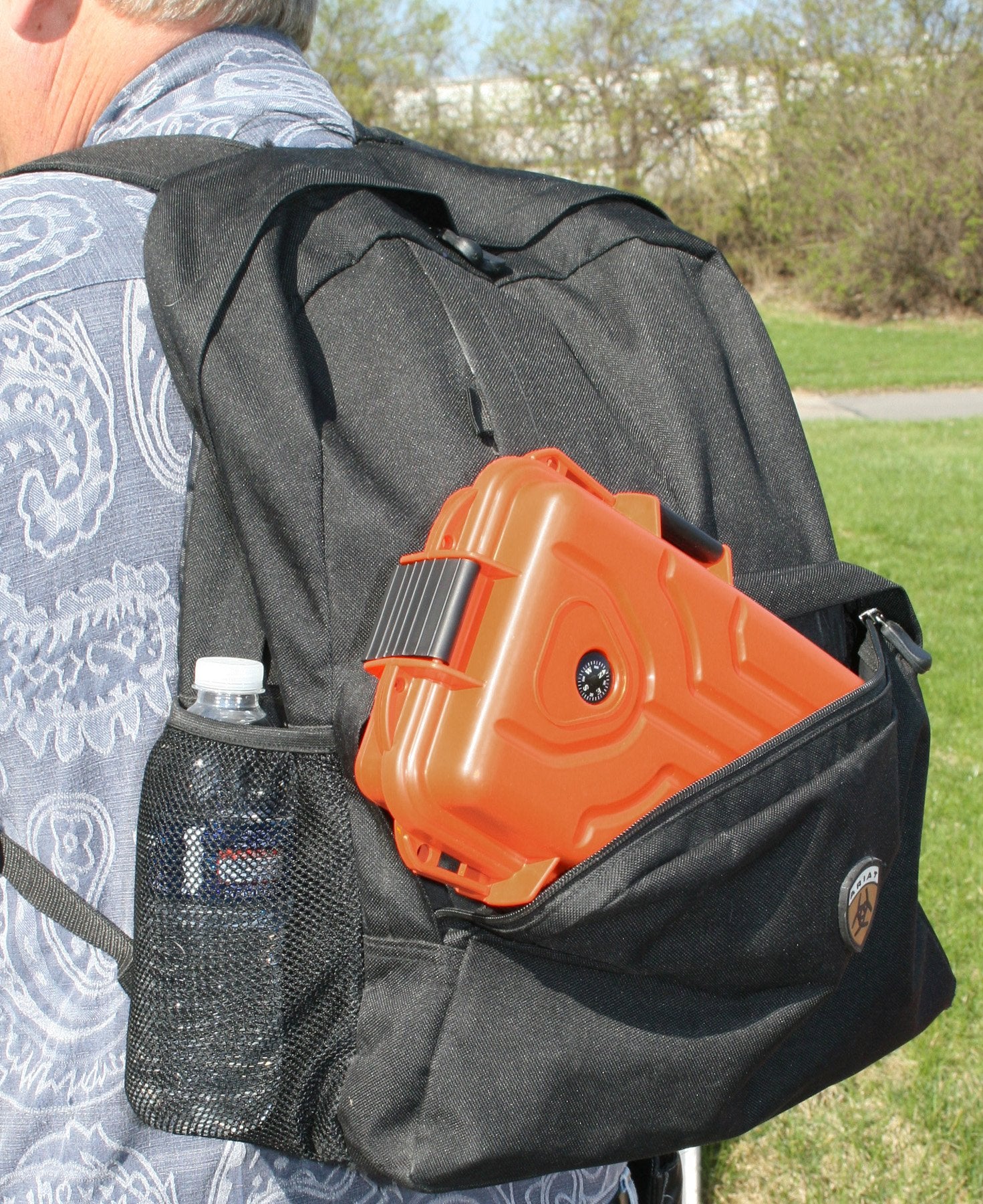 MTM Survivor orange large box showing built-in compass for navigation