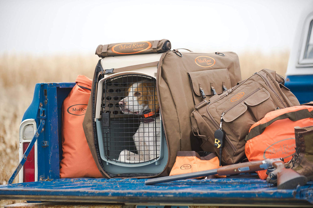 Mud River Dog Handler Bag brown reinforced bottom supports rugged outdoor use.