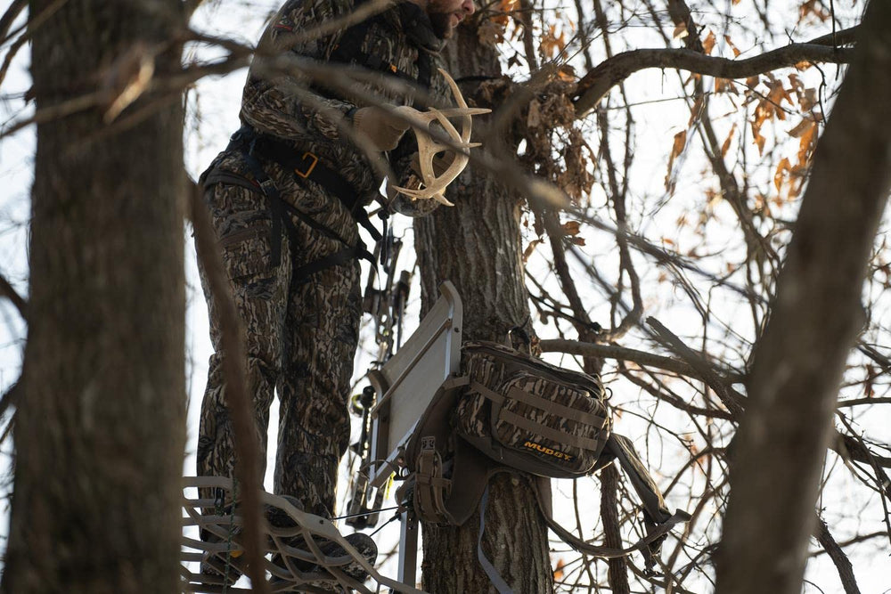 MUDDY Pro 500 lumbar pack Mossy Oak Bottomlands camo blends with terrain.