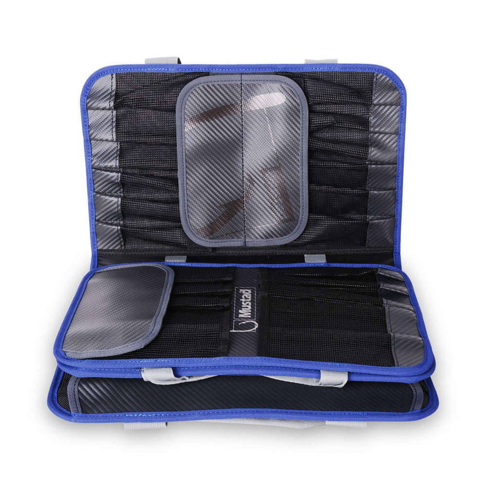 Mustad Jig Bag close-up of click-lock strap closure keeping contents secure.