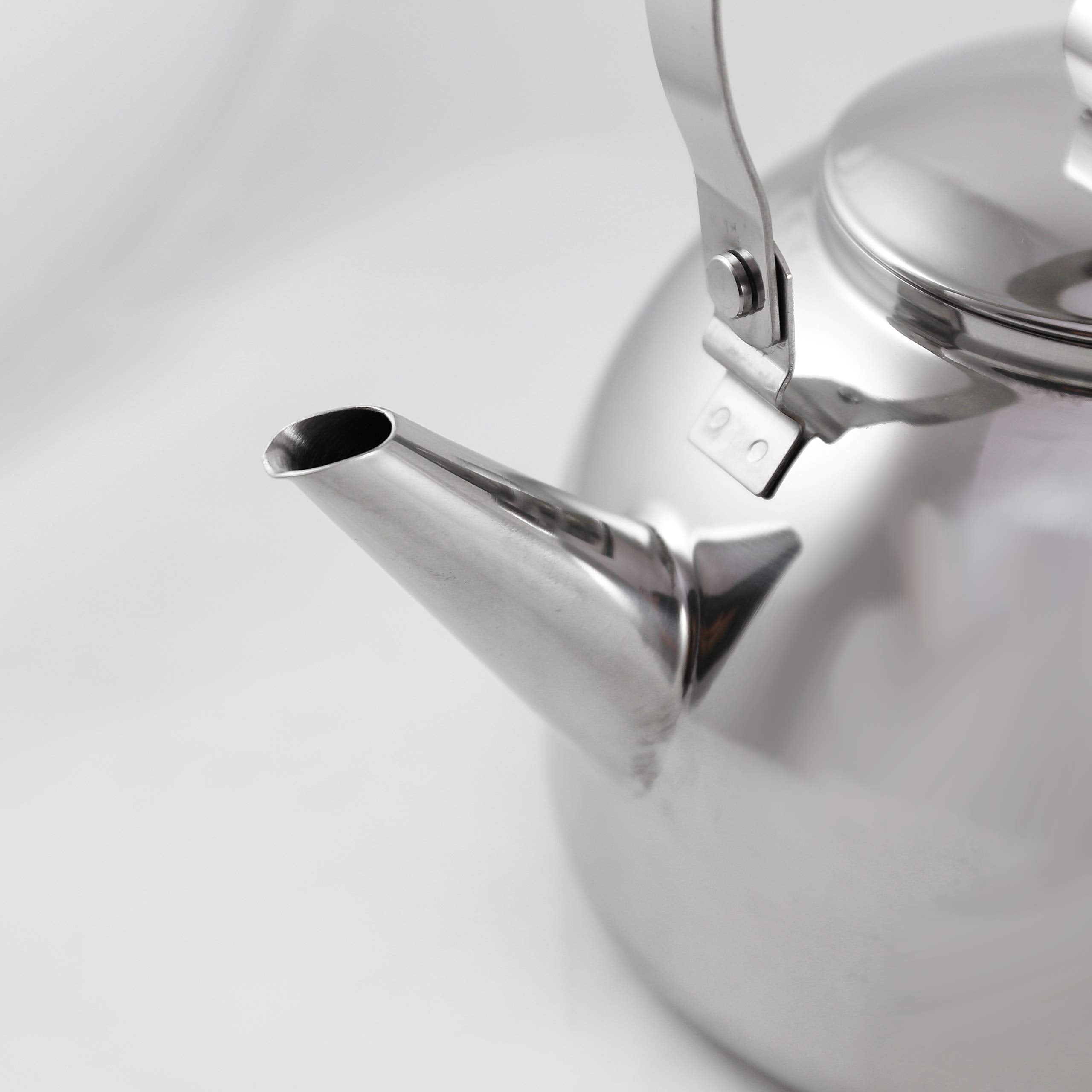 Muurikka camping kettle shaped handle hanging over campfire