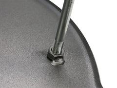 MUURIKKA griddle pan legs-over-fire-setup ensures stable placement over flames for outdoor cooking.
