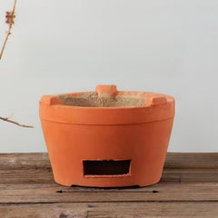 Mwpqbd Chaozhou red clay stove close-up, showcasing rustic craftsmanship and durable texture for outdoor tea.