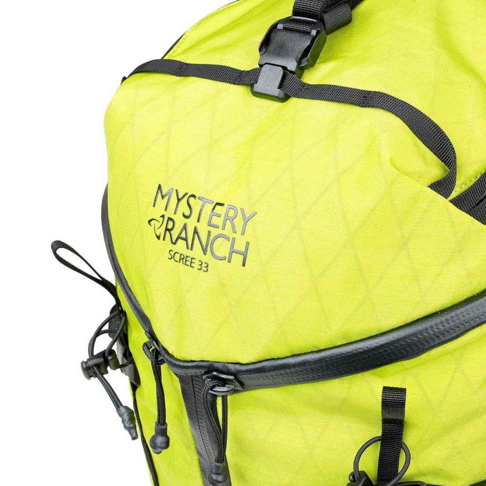 Mystery Ranch Scree 33 limeade color enhances visibility on outdoor trips.