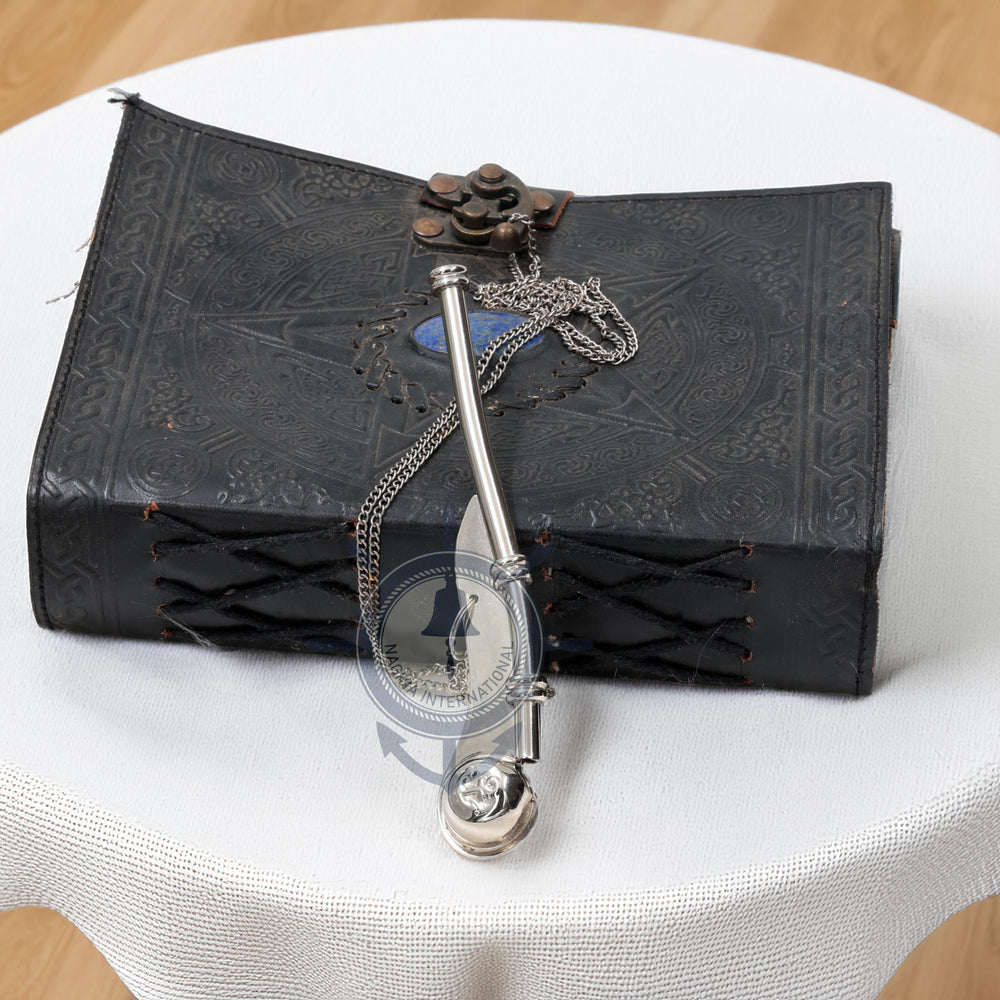Nagina International nautical decor setup featuring brass whistle for seafaring ambiance