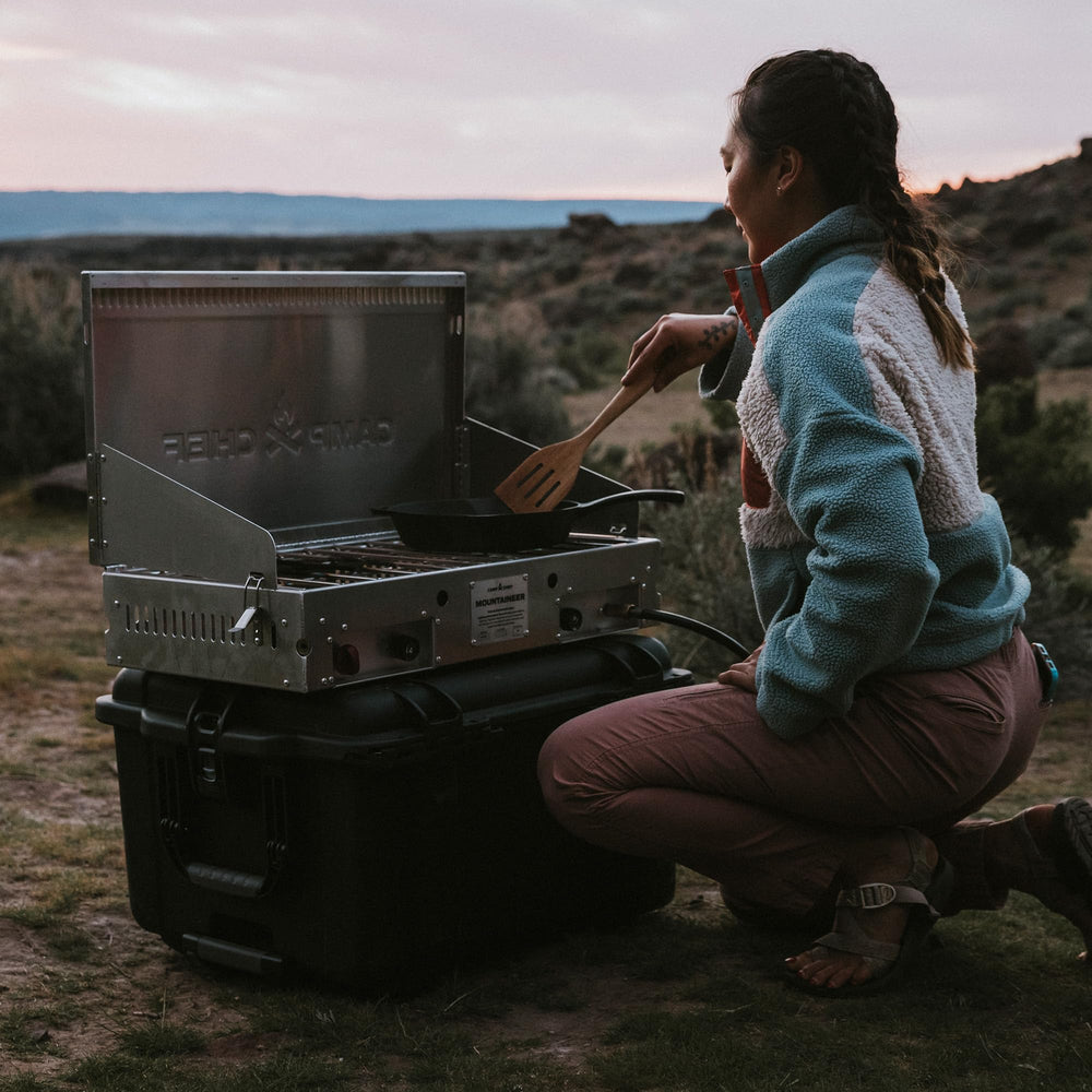 Outdoor camping scene with NANUK Trail 80 storage box