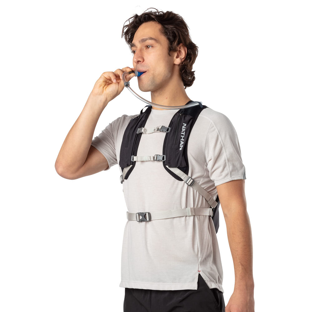Nathan Crossover 15L hydration pack gear pockets open to quick access and packing convenience.