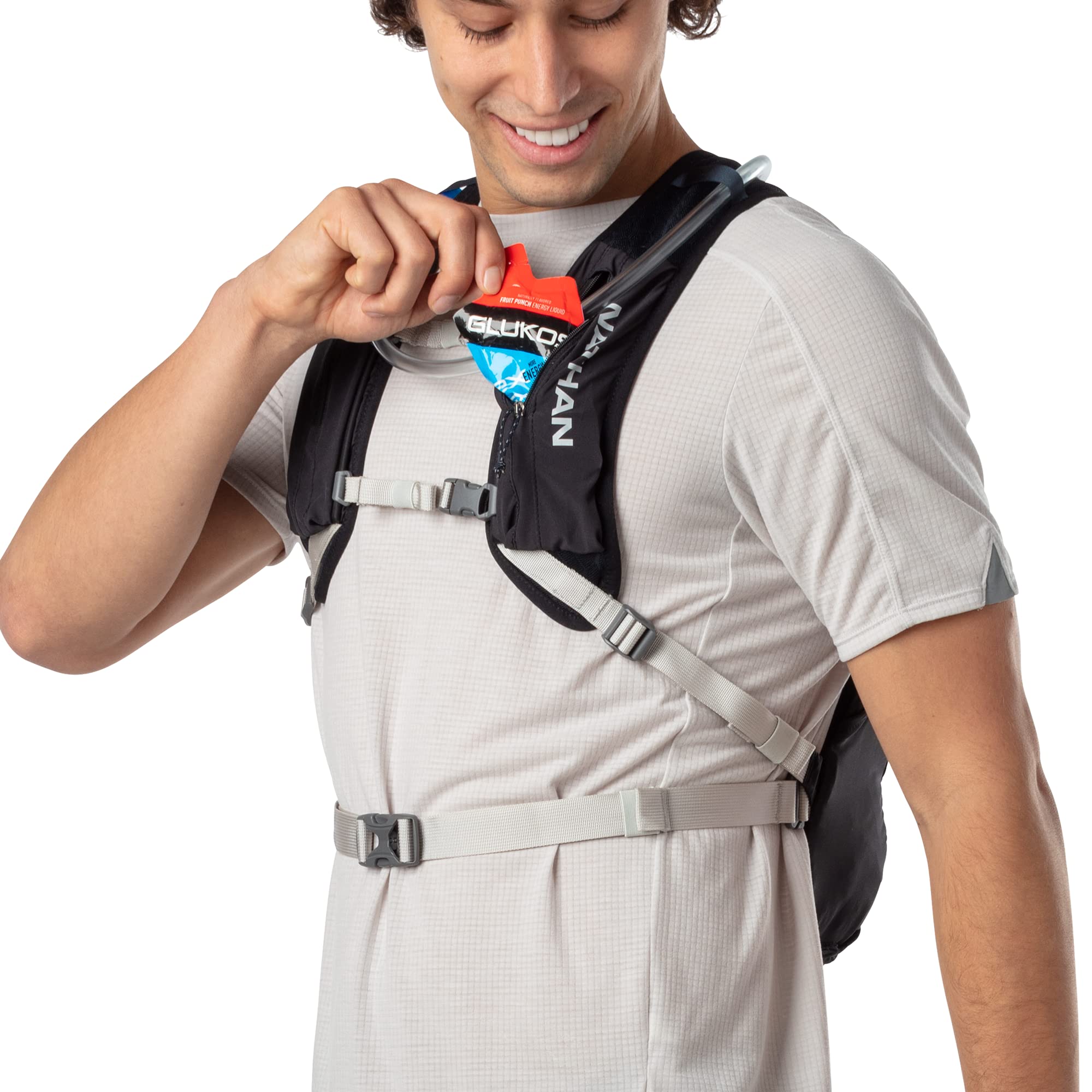 Nathan Crossover 15L hydration pack reflective trim boosts visibility during dawn or dusk activities.