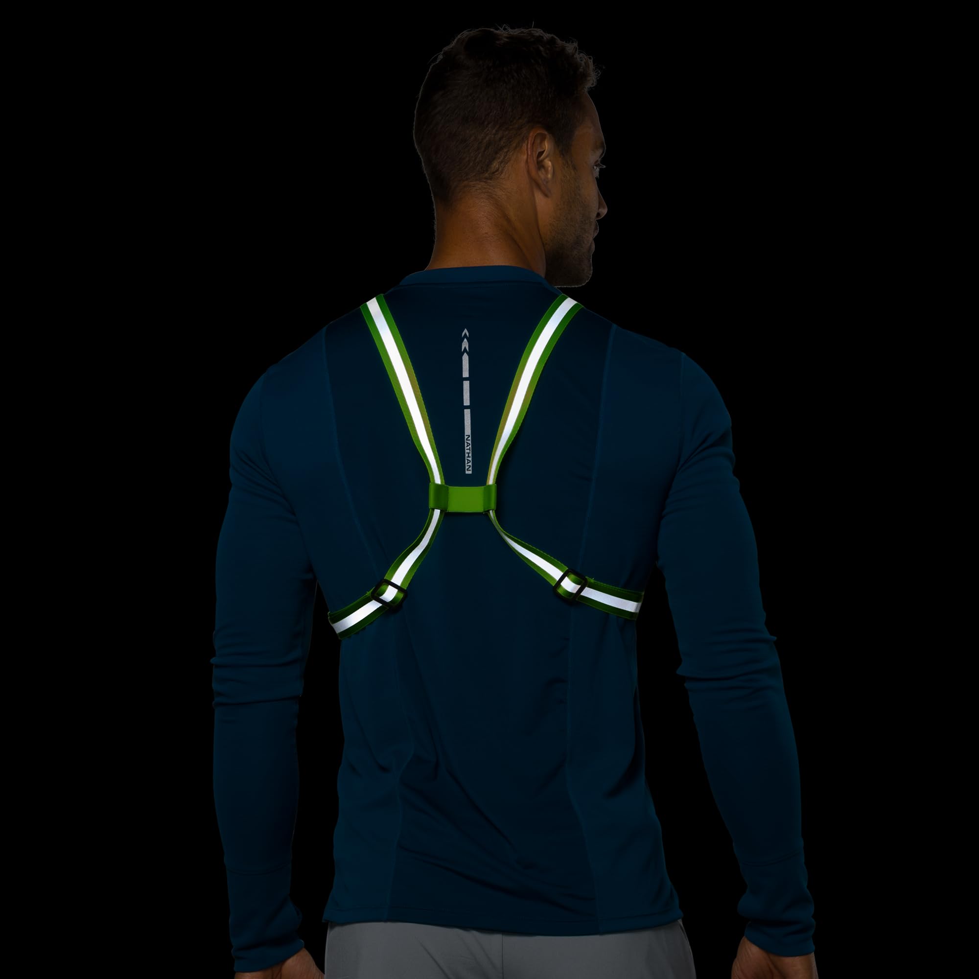 Nathan Hypernight Reflective Vest Lite in-use view shows practical safety in urban running.