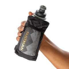 Nathan reflective 360-degree bottle enhances visibility during evening workouts.