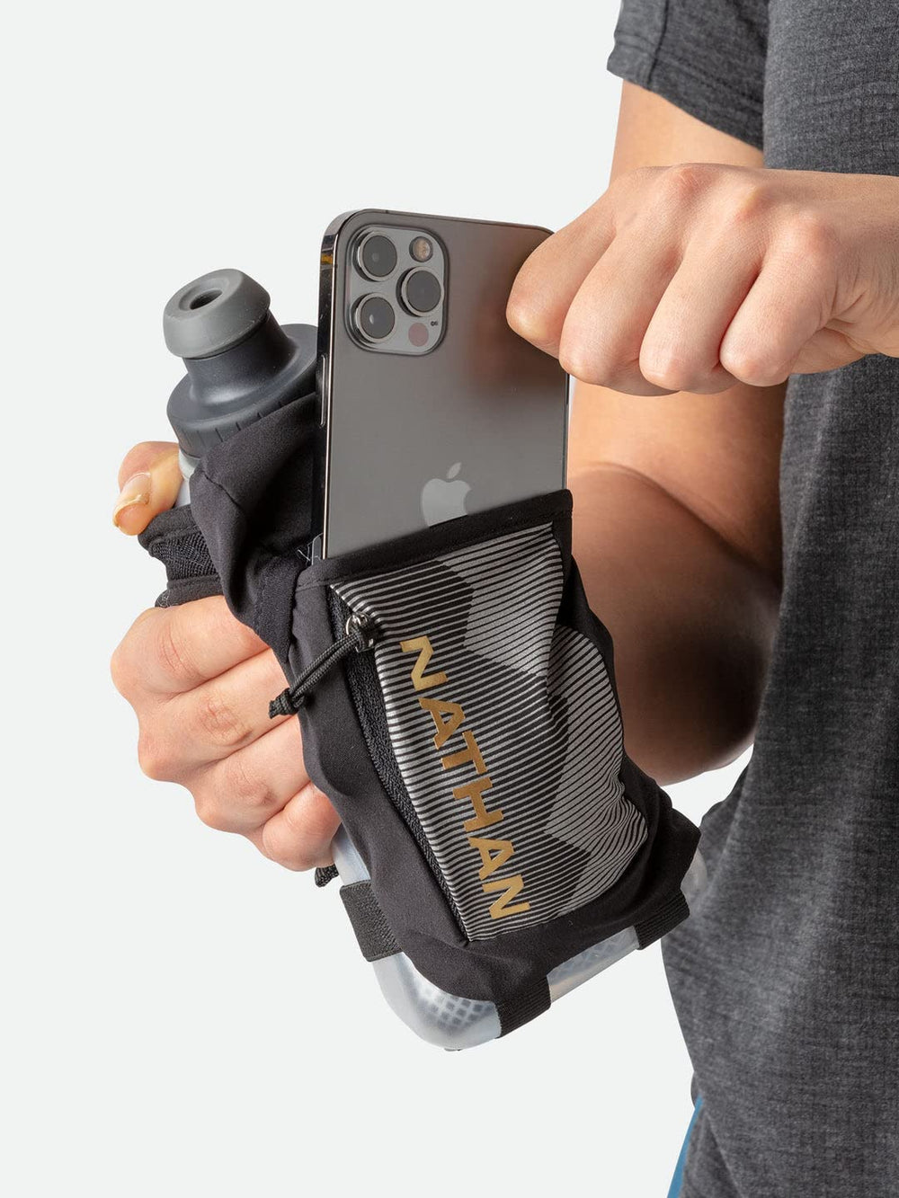 Nathan Running Handheld reflective print boosts safety through increased night visibility.