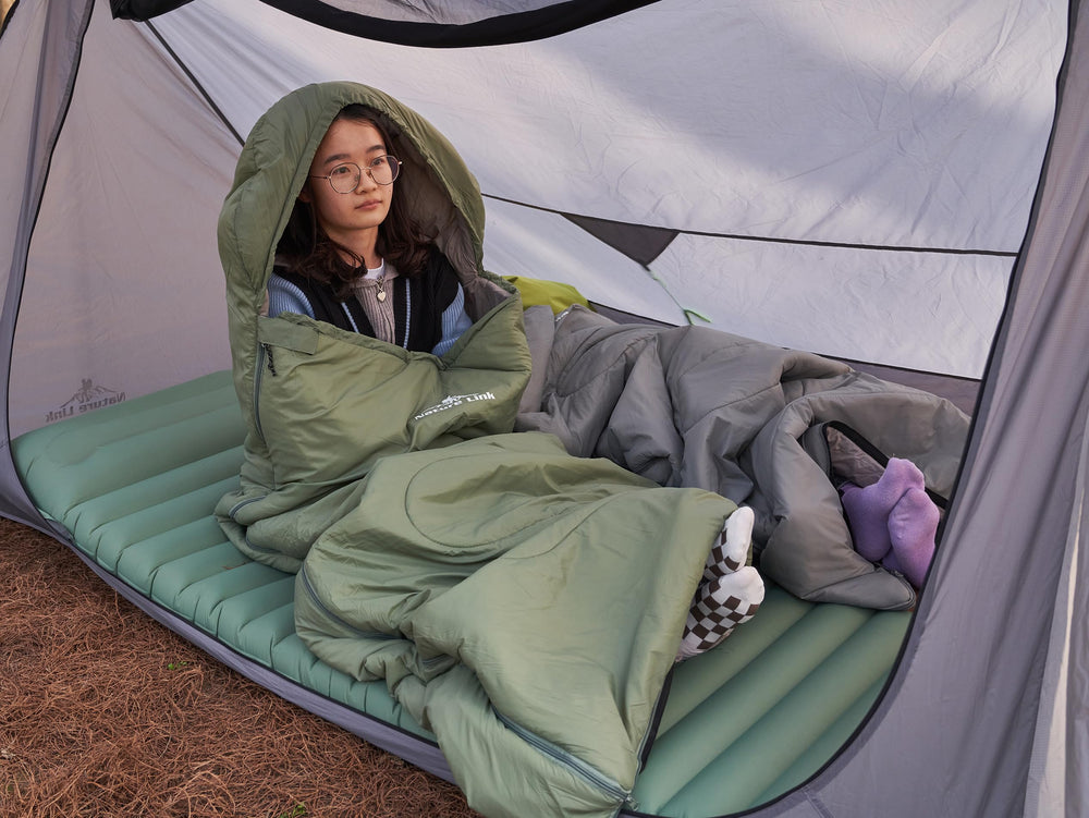 Nature Link sleeping bag setup outdoors suits camping and hiking trips.