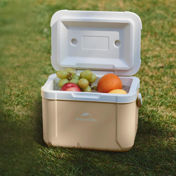 Naturehike 5.3 Qt hard cooler on the beach illustrates a versatile outdoor companion