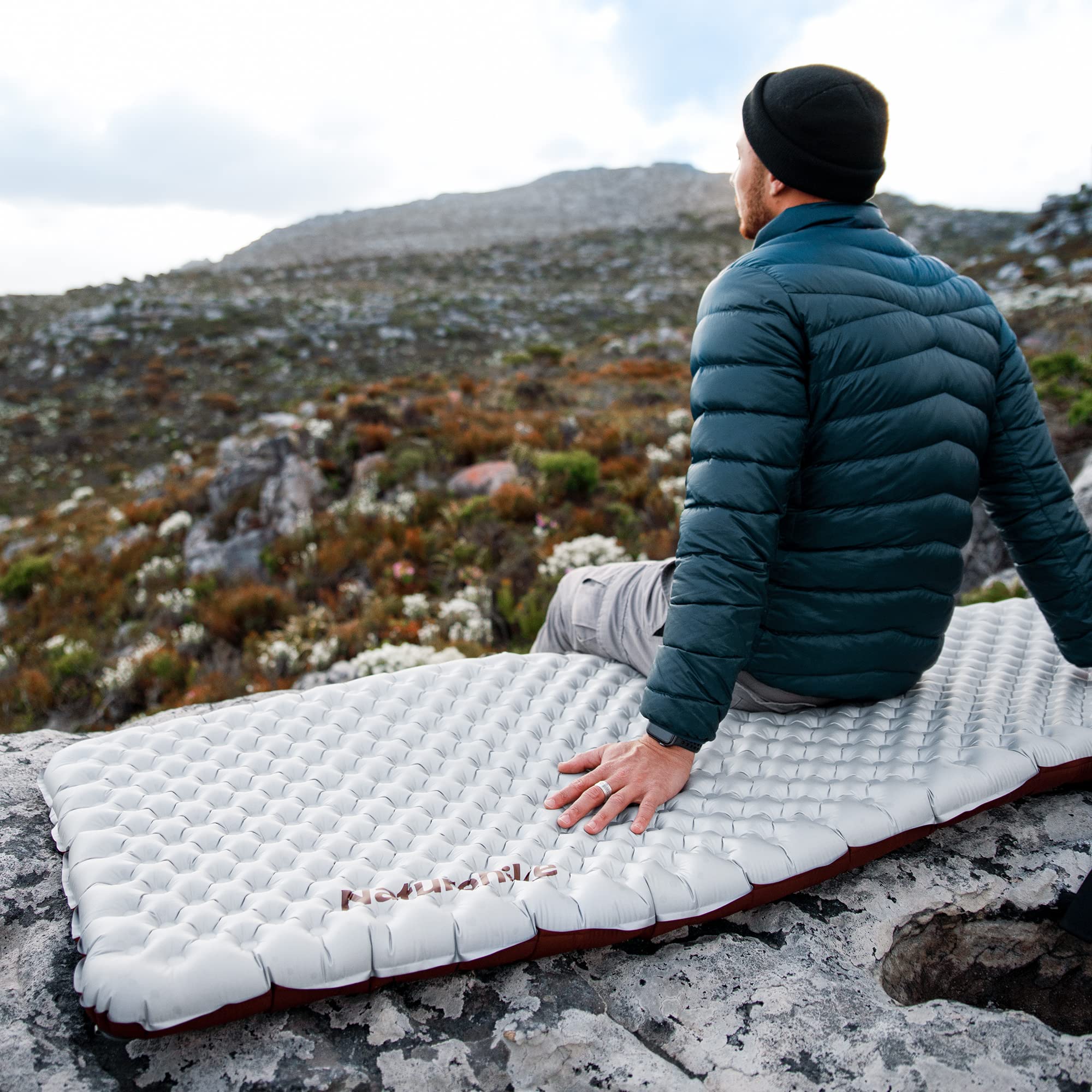 Naturehike silver rectangular sleeping pad laid on ground for rest