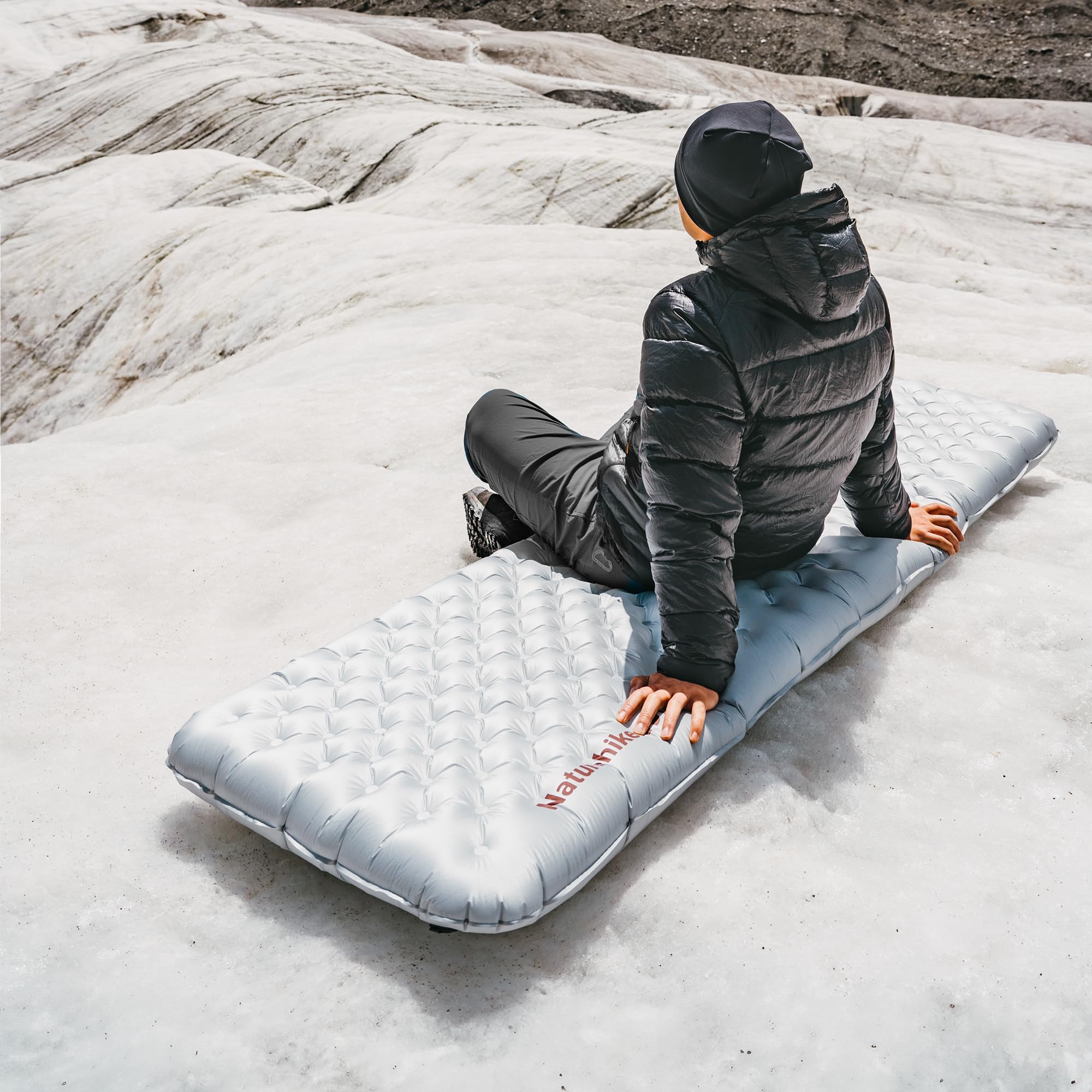 Naturehike ultralight sleeping pad weighs just 18oz for easy backpacking setups.