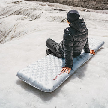Naturehike ultralight sleeping pad weighs just 18oz for easy backpacking setups.