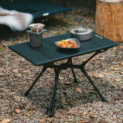 Naturehike YL01 folding-table-in-use on campsite delivers quick setup and compact storage.