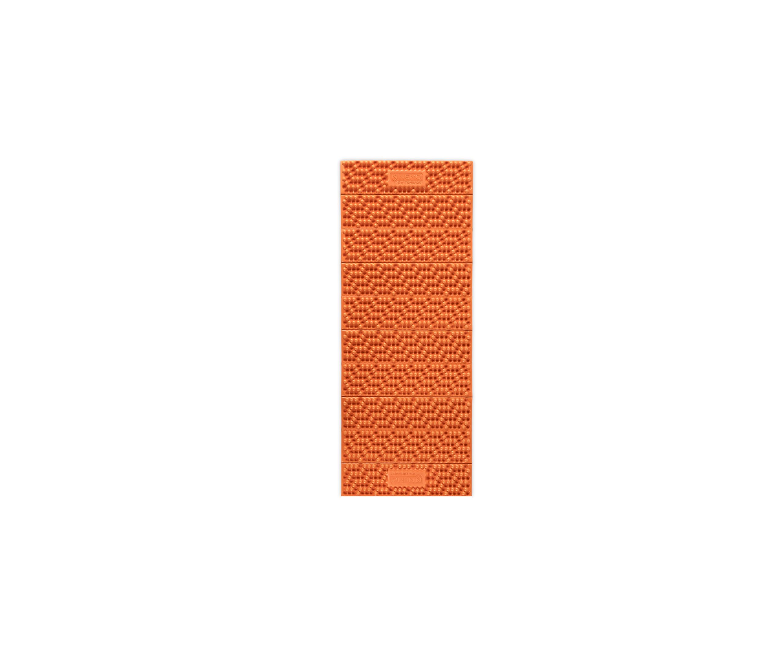 NEMO Switchback foam sleeping pad Short in Sunset Orange on a rugged campsite, highlighting plush comfort