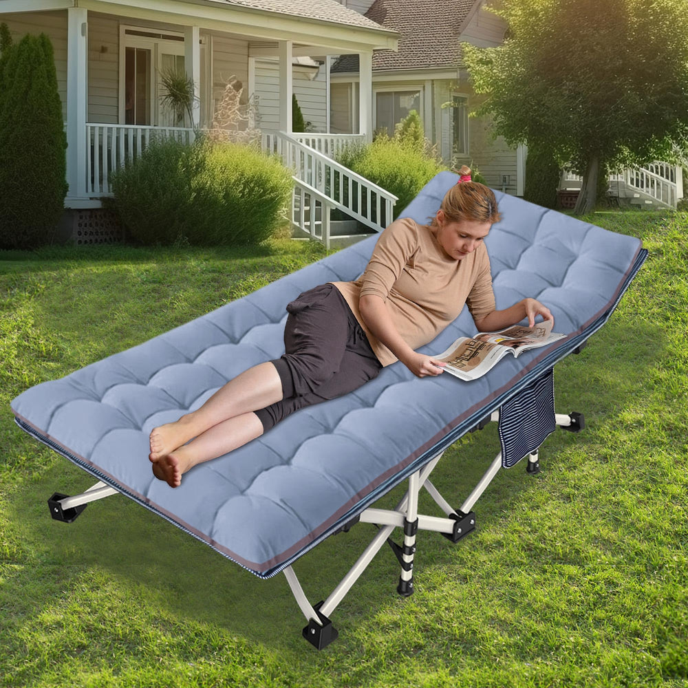 NESDCC cot with soft mattress pad provides comfortable sleep for guests.
