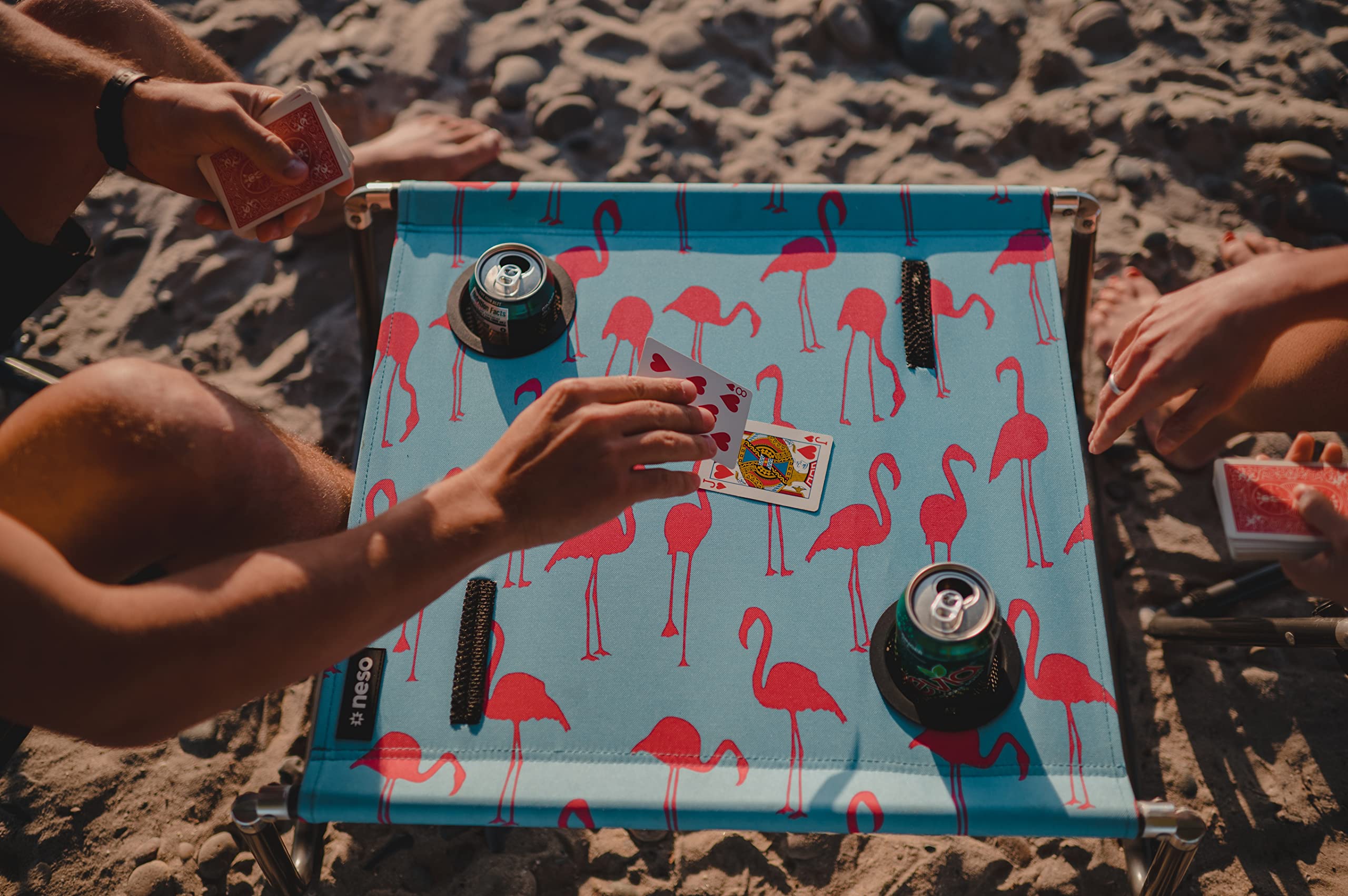 Neso Beach Table cup holder keeps beverages stable on sunny days