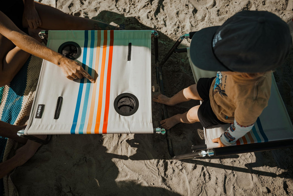 Neso Beach Table folded flat fits in carry bag for easy travel.
