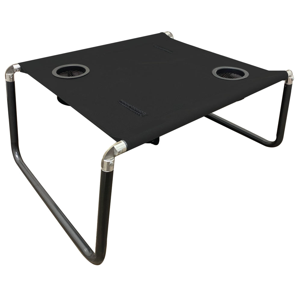 Neso Beach Table folded for compact portability and easy storage.