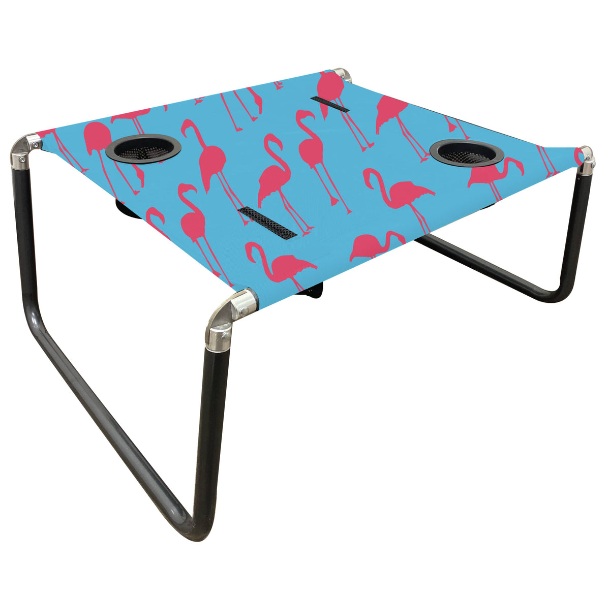 Neso Beach Table setup with flamingos keeps drinks within reach on the sand