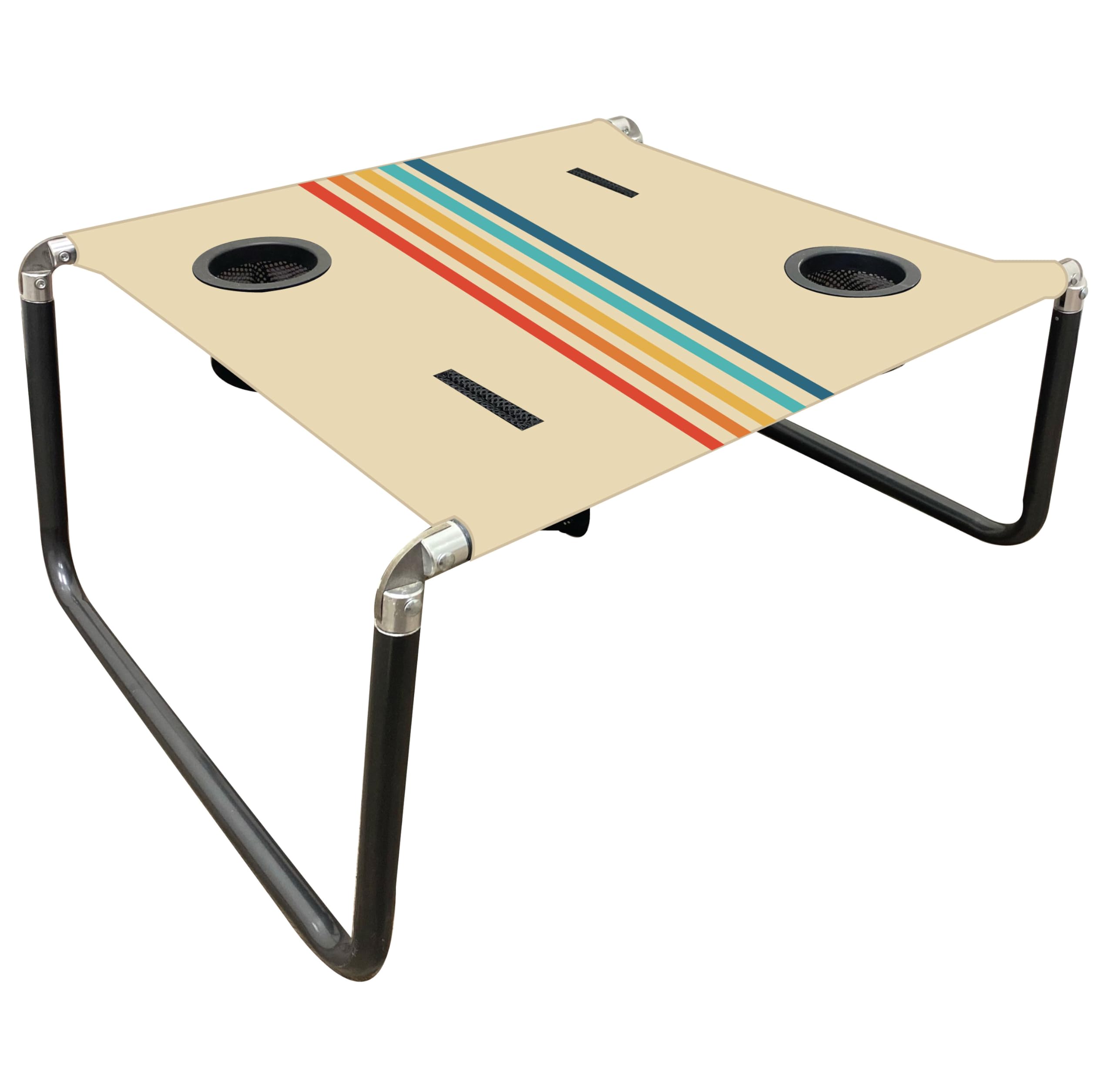 Neso Beach Table setup on sand provides a stable surface for snacks and drinks.