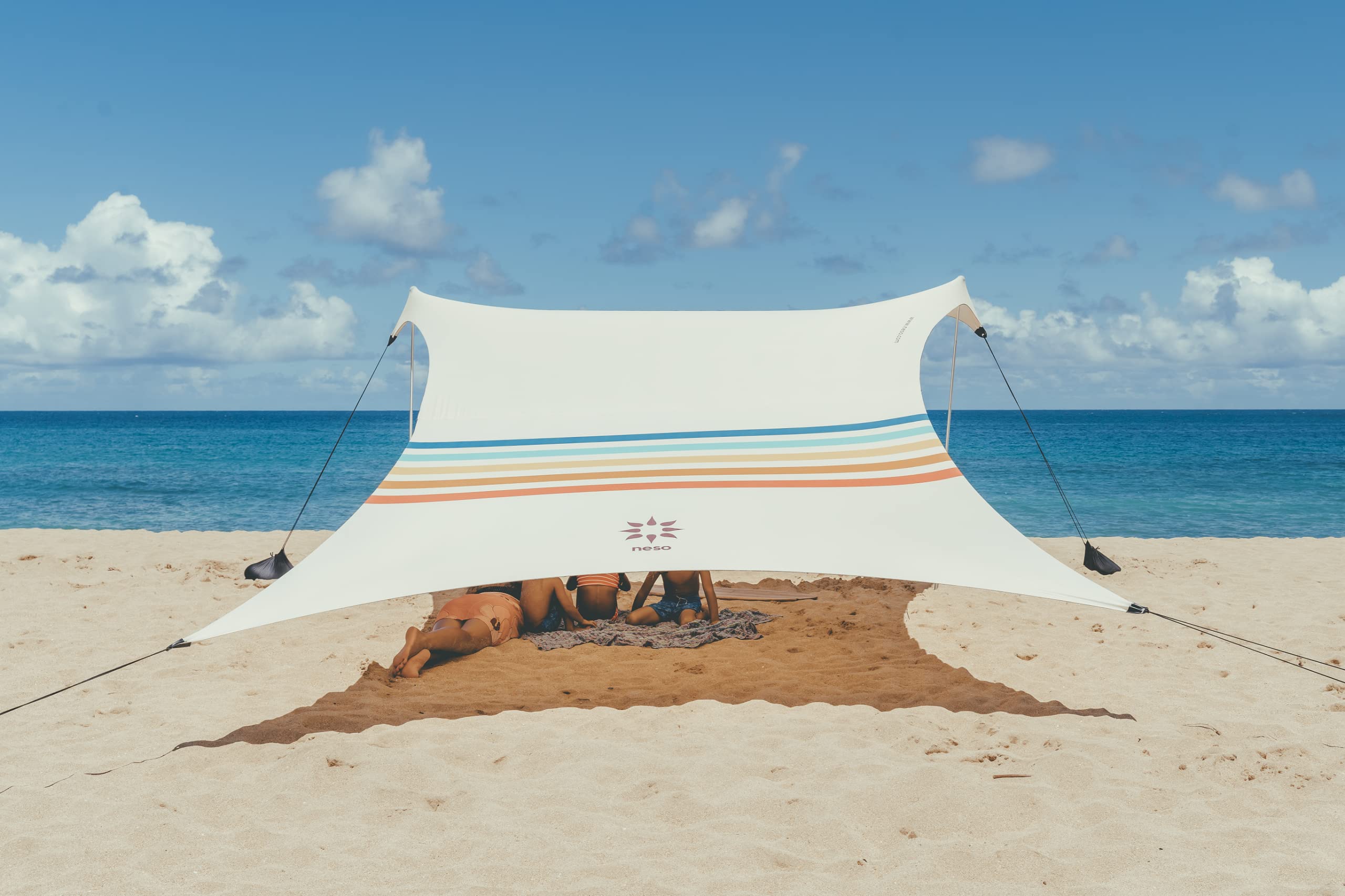 Neso Grande beach tent setup demonstrates quick shade for family beach day.