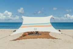 Neso Grande beach tent setup demonstrates quick shade for family beach day.