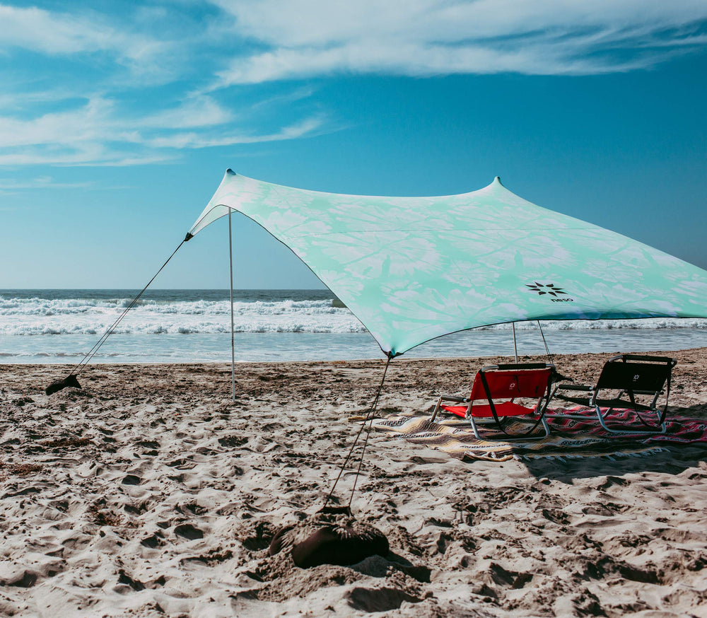 Neso Grande mint tie-dye packed in carry bag demonstrates portability and travel-ready design.