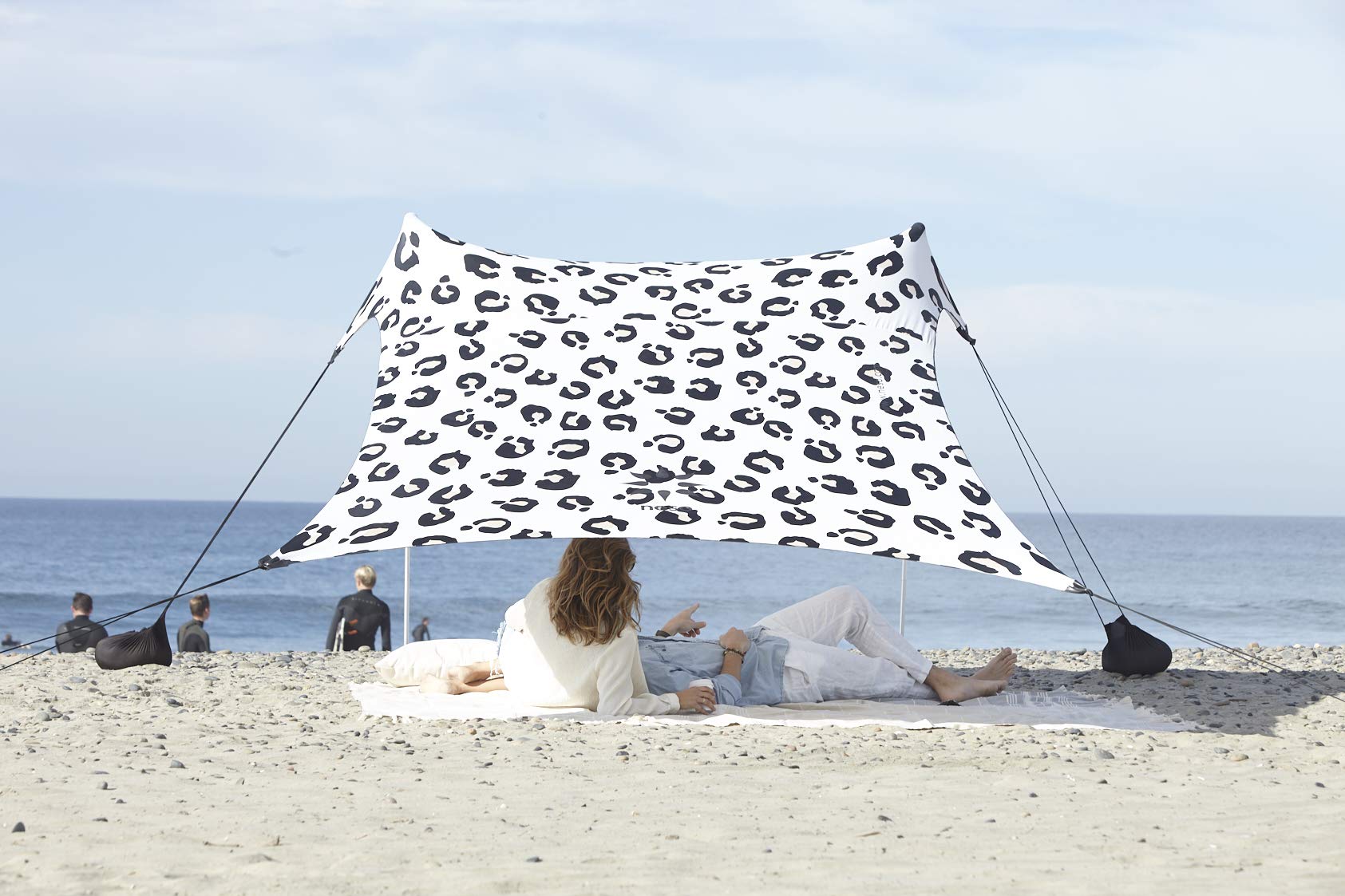 Neso Leopard tent assembled on the beach delivering quick shade and airflow.