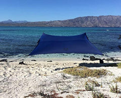 Neso portable beach tent 7x7 navy provides lightweight shade for family outings.