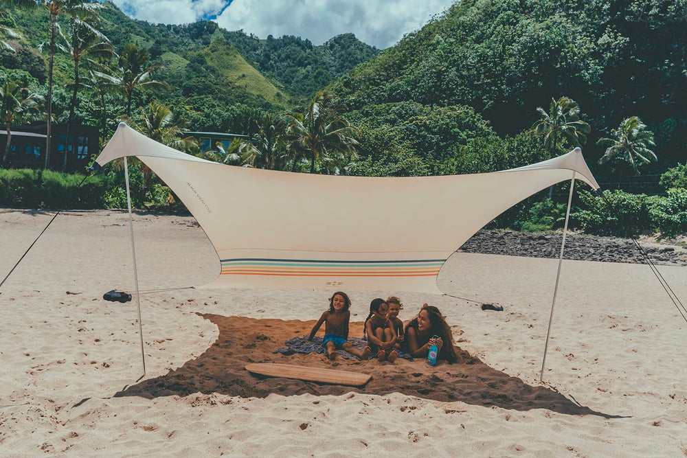 Neso sand-anchor bags in use stabilize shelter on breeze-filled shores