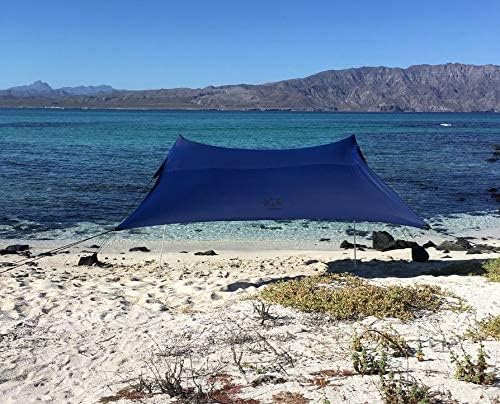 Neso sand-anchor bags fill securely to stabilize the canopy on windy beaches.