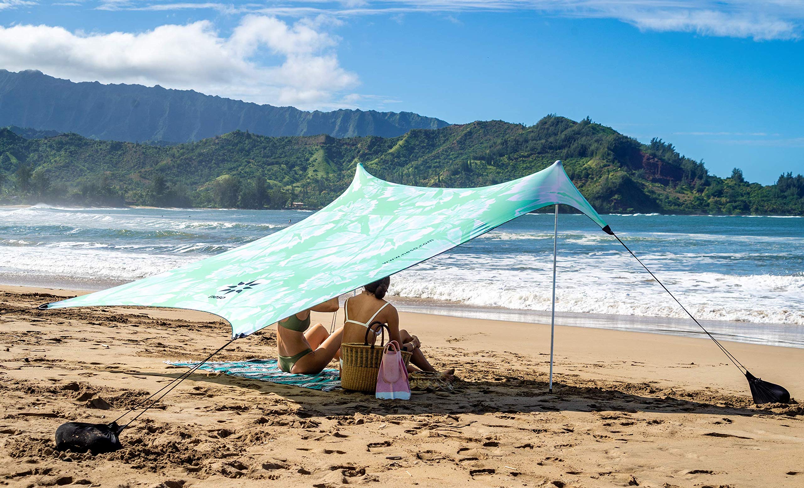 Neso sand anchor bags in action providing stable shade on windy days.