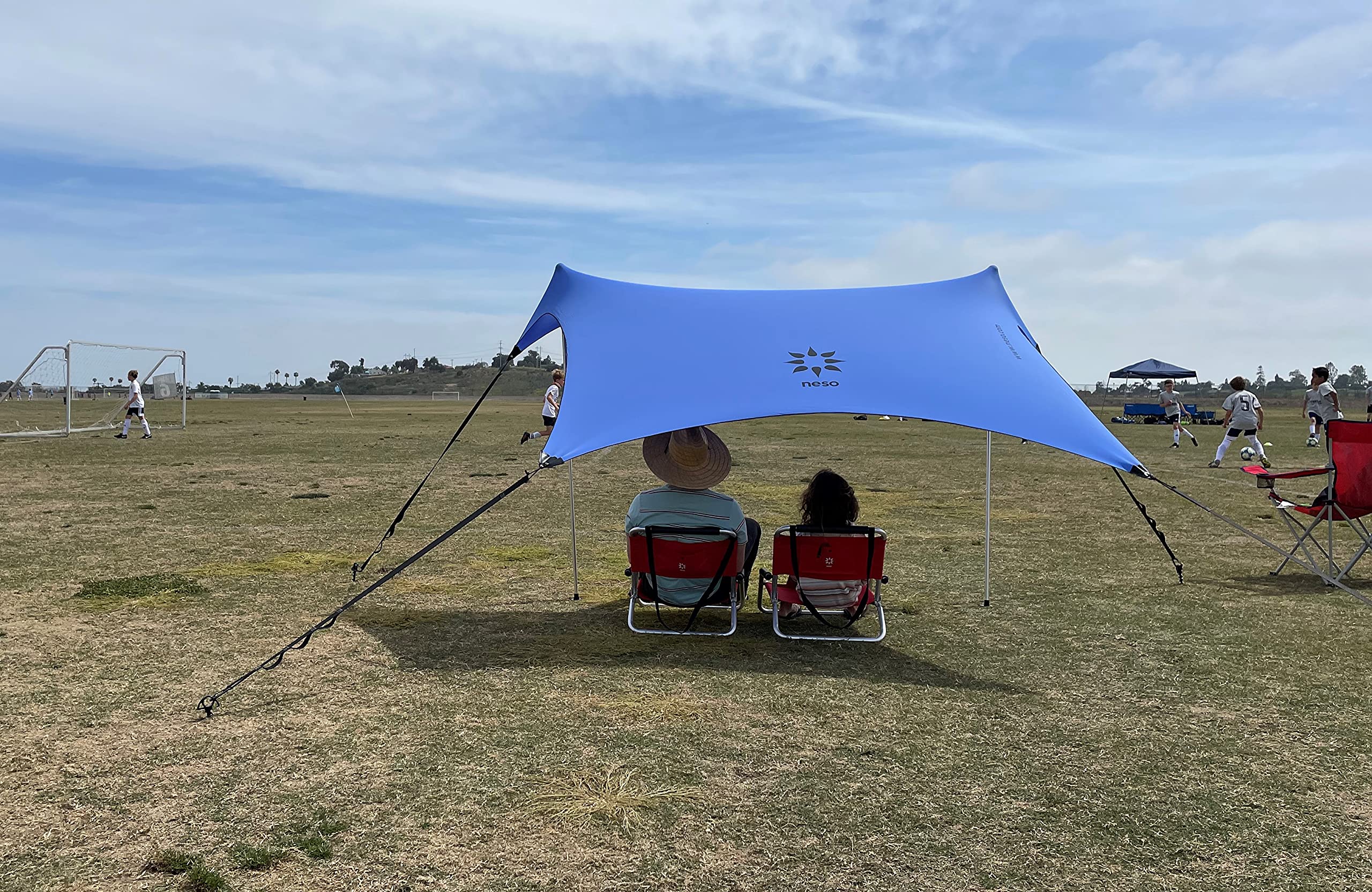 Neso Sidelines 1 periwinkle assembled for on-field shade and sun protection.
