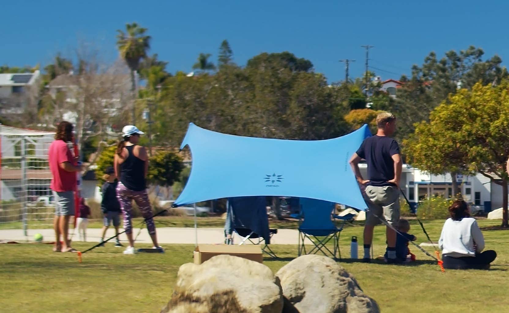 Neso Sidelines 1 in use provides instant shelter during games and beach days.