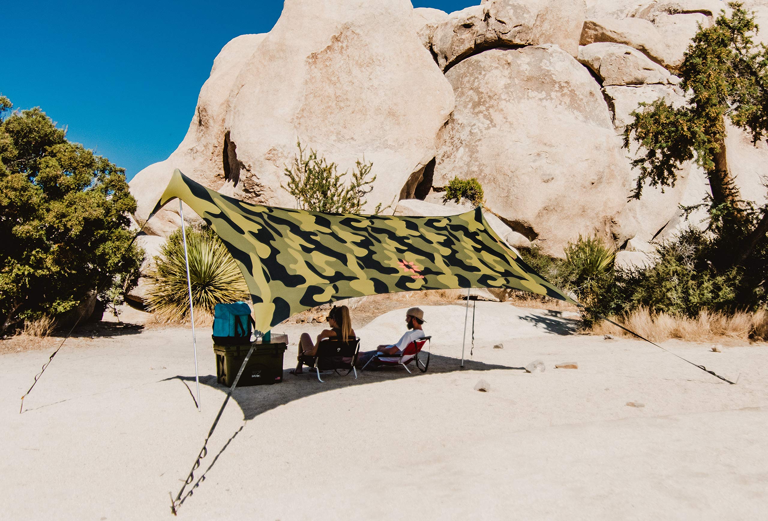 Neso Sidelines Grande camo tent deployed at field for quick shelter.