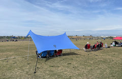 Neso Sidelines Grande side view highlights its 50 sq ft shade and quick setup.