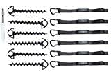 Screw stakes and carabiners enable flexible anchoring on sand or ground.